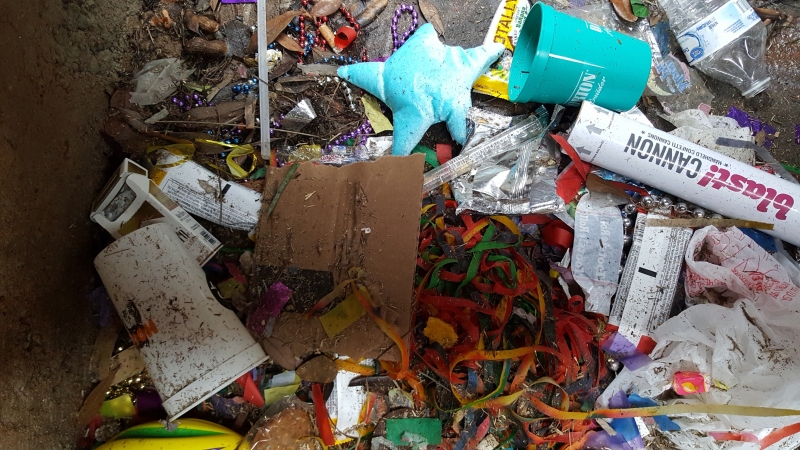 Mardi gras debris on the ground.