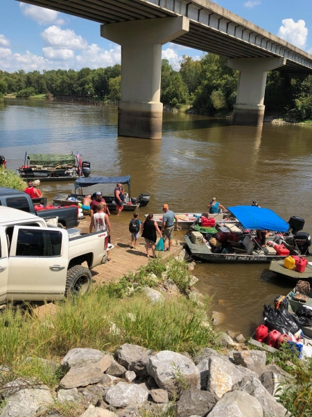 Volunteers on the banks of a river.