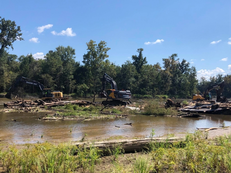 Heavy machinery on the banks of a river