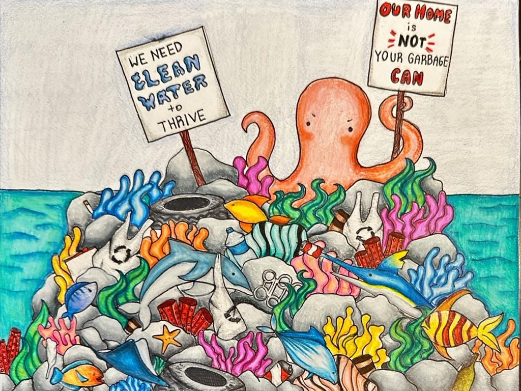 A drawing of a coral reef full of sea creatures and trash, with an octopus at the top holding two signs reading "We need clean water to thrive" and "Our home is not your garbage can."