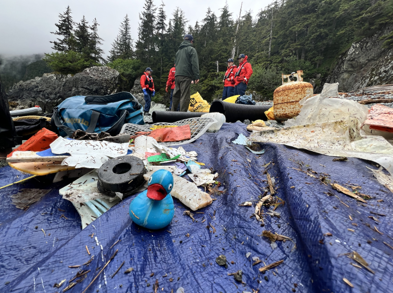 Debris is sorted on a tarp.