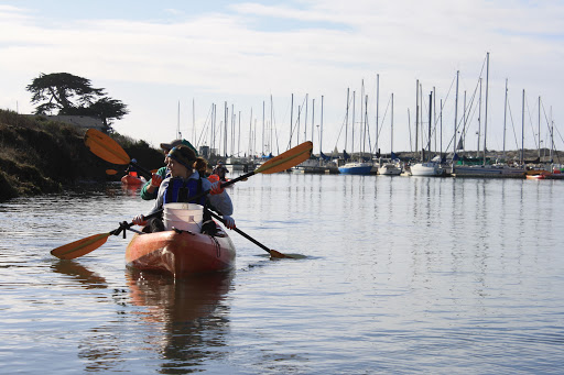 People in a two person kayak.