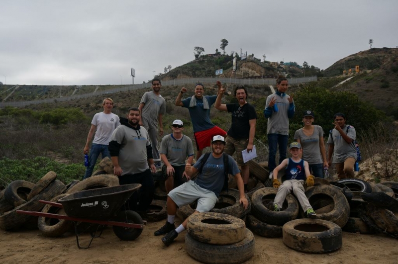 People sitting on a pile of tires