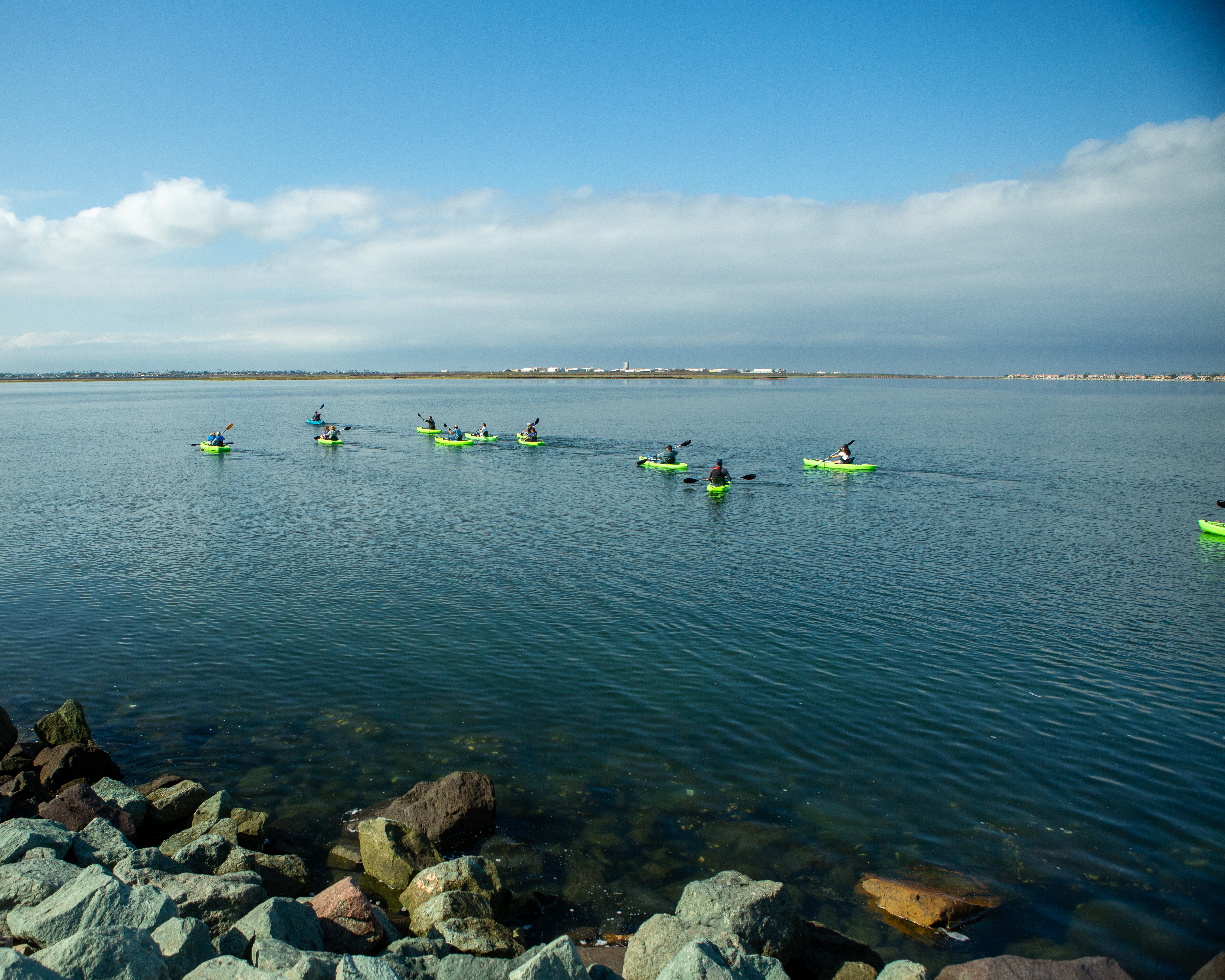 People on kayaks on the water.