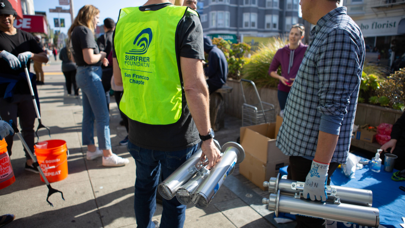 Volunteers installing cigarette receptacles.