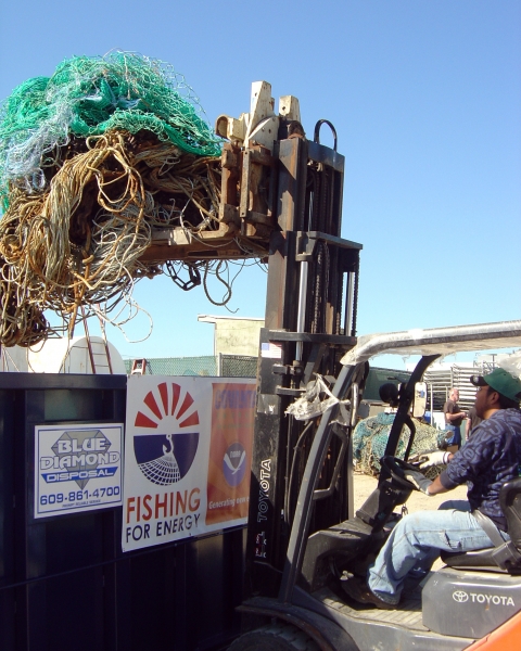 Fishing gear getting placed into a collection bin.