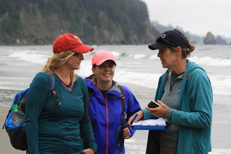 NOAA MDP Chief Scientist Amy Uhrin, NOAA MDP California Regional Coordinator Sherry Lippiatt, and CSIRO's Denise Hardesty discuss monitoring on Third Beach, WA.