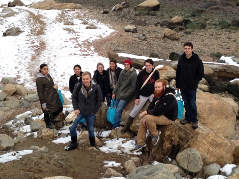 A group of students on a beach.
