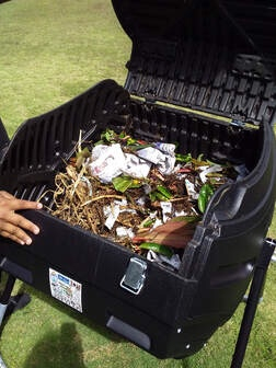 An opened compost bind displaying its contents. 