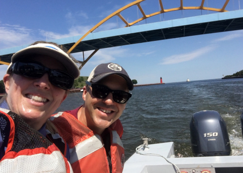 Two researchers on a boat.