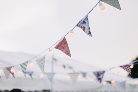 Fabric bunting blowing in the wind.
