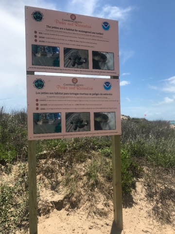 A sign on the beach.