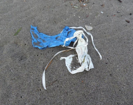 Remnants of rubber balloons with strings attached.