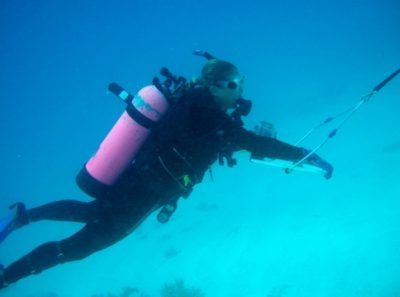 Researcher Amy Uhrin surveys derelict traps during a towed diver survey.
