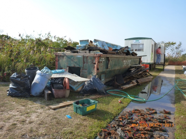 A dumpster full of collected debris.