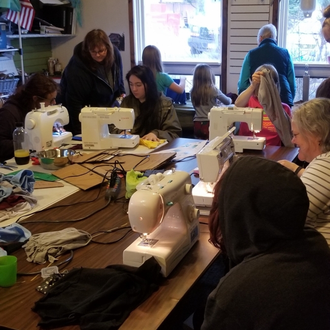 Students sew reusable bags.