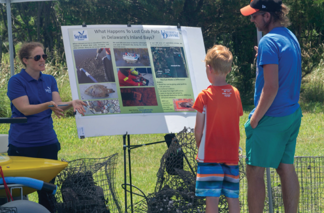 Three people learn about derelict crab pots.