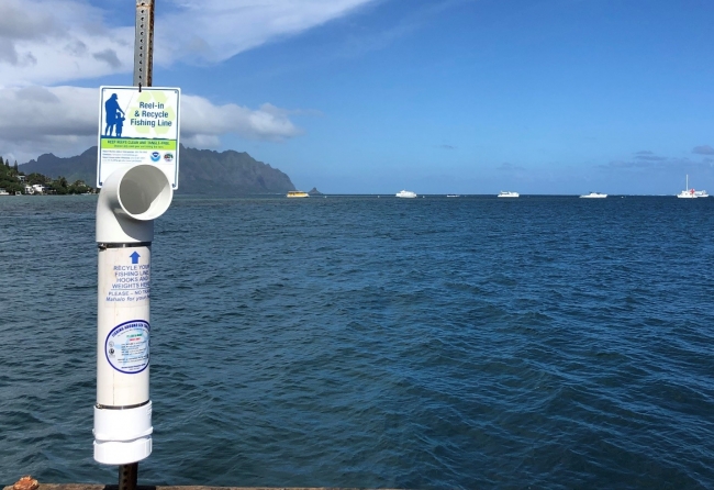 A fishing line recycling bin located at a harbor. 