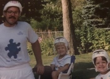 Father and daughters enjoying a bike ride. 