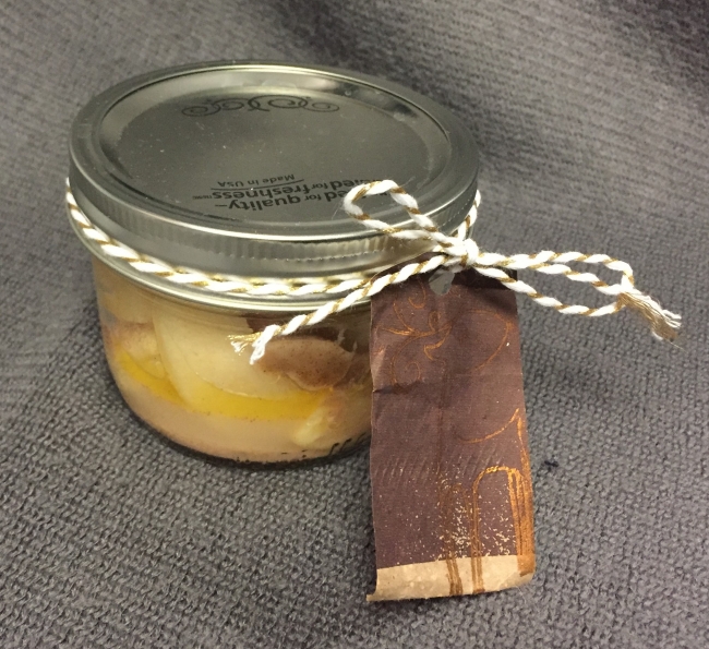 A jar with an attached gift tag.