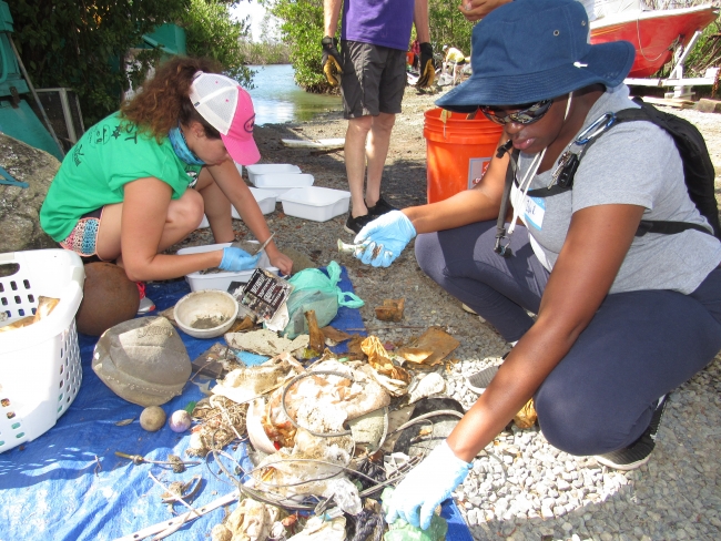 Volunteers sorting through debris.