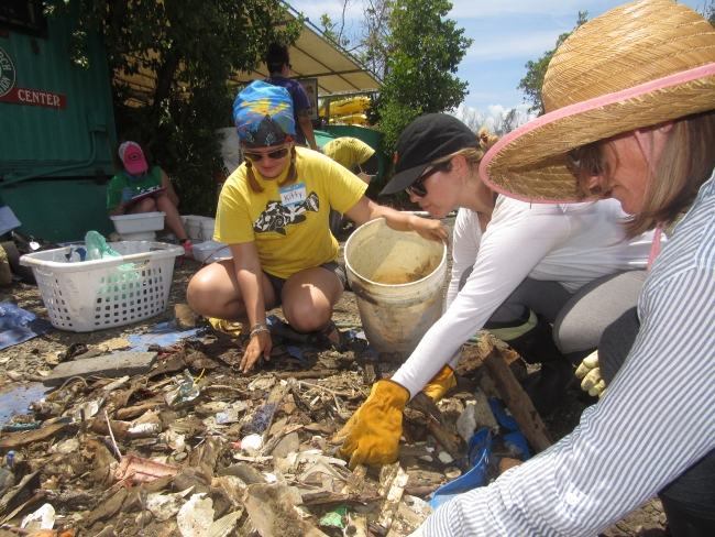 Volunteers sorting through debris.