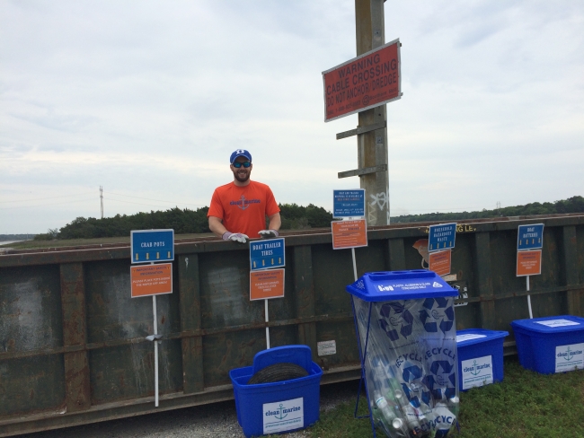 A Clean Marine volunteer helps collect items for disposal or recycling from the Limehouse Bridge Boat Landing near Charleston, SC.