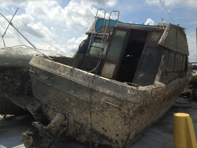 An abandoned and weathered motorboat.