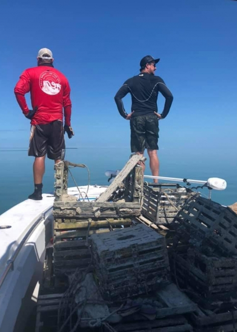 Charter captains scanning the water from a vessel.