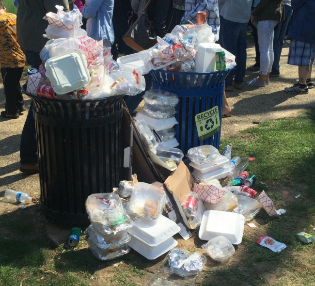 Two overflowing trash bins.