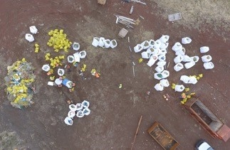 An aerial view of debris sorted into piles.