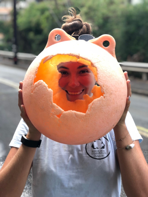 Tanya smiles through a hole in a buoy.