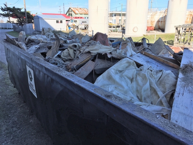 Debris that was removed from Beaufort’s waterway sits in a dumpster.