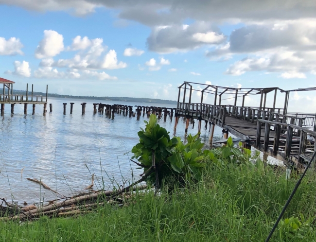 A pier with heavy damage from a hurricane.