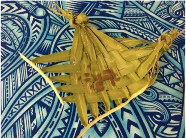 A plate make of woven palm leaf.