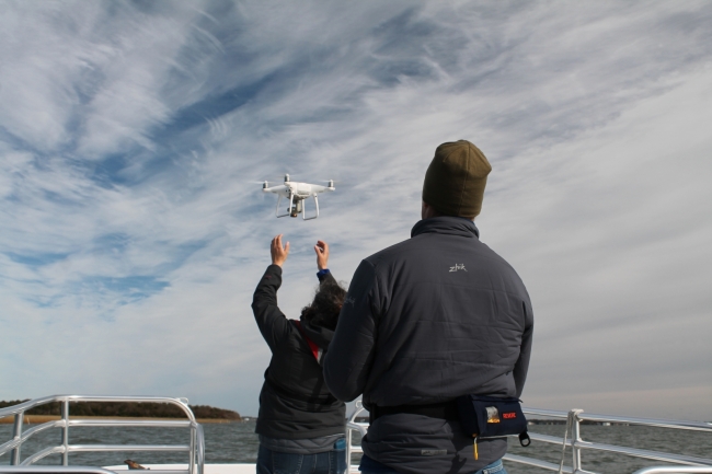 TowBoatUS Foundation and Paul Cronin studios retrieve an unmanned aerial vehicle during filming of the marine debris project documentary.