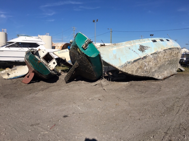 Abandoned vessels removed from Beaufort’s waterway sit on land.