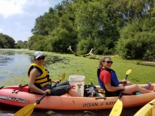 Volunteers in a kayak on Pajaro River. 