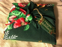 A gift wrapped in floral fabric. 