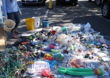 Piles of sorted debris collected during a cleanup.