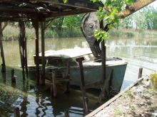 A derelict vessel is removed with an excavator on Fordson Island. (Photo Credit: NOAA)