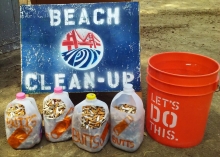 Milk jugs holding collected cigarette butts.