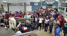 A group of students on a pier.