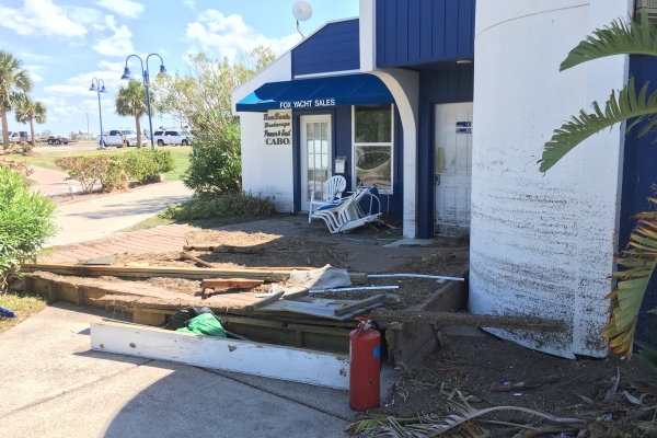 Lawn furniture and other building debris outside of a business. 