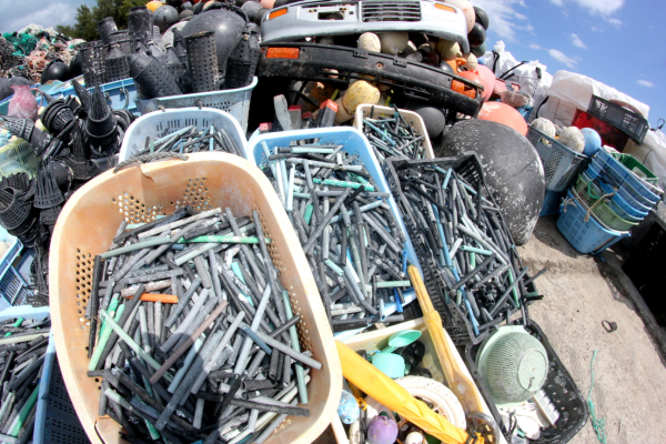 Buckets of plastic oyster spacer tubes.