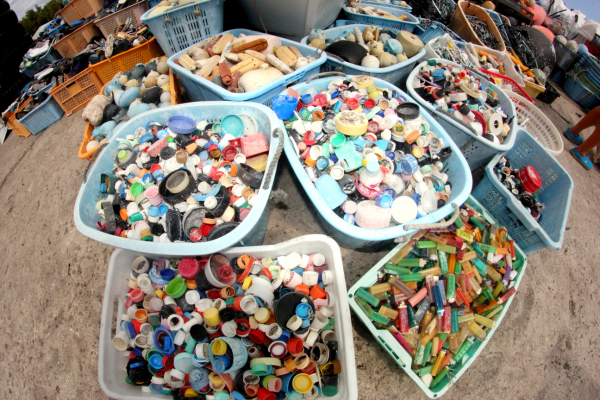 Buckets of bottle caps and lighters.