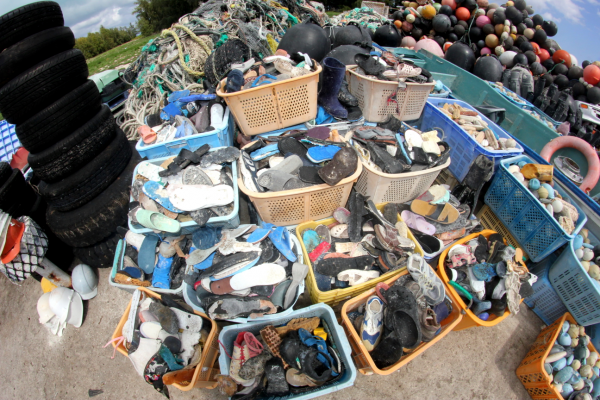 Buckets of flip flops sandals.